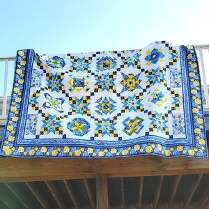 Quilt, throw pillows and valance.